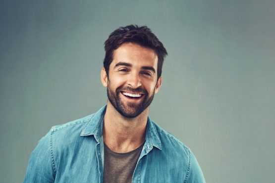 Portrait,,Happy,And,Man,In,Studio,For,Smile,,Fashion,And Suks Minhas Male Fertility Expert