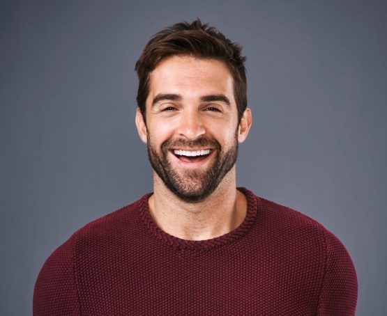 Studio,,Confidence,And,Man,With,Smile,,Portrait,And,Fashion,Of Suks Minhas Male Fertility Expert